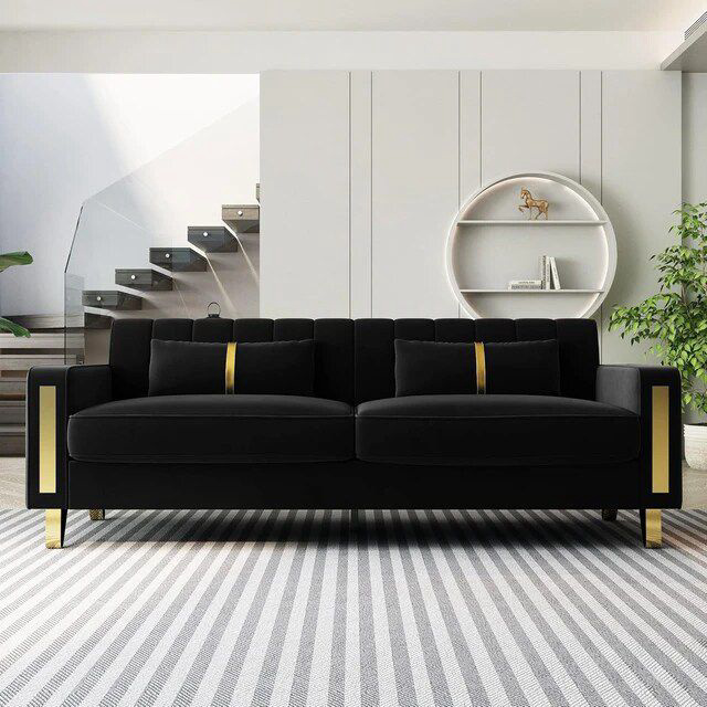 Sectional black couch with golden legs 