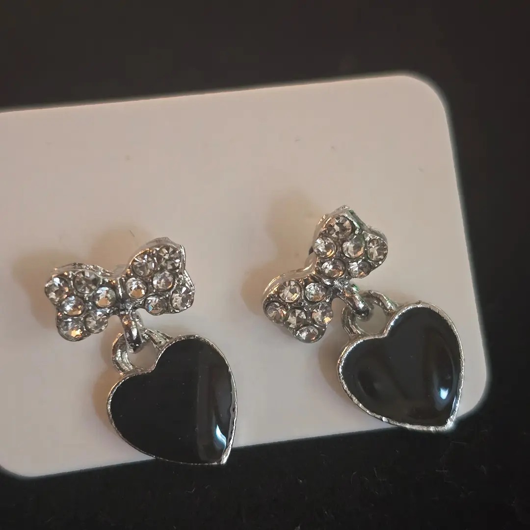 Black heart and silver gem bow earrings 