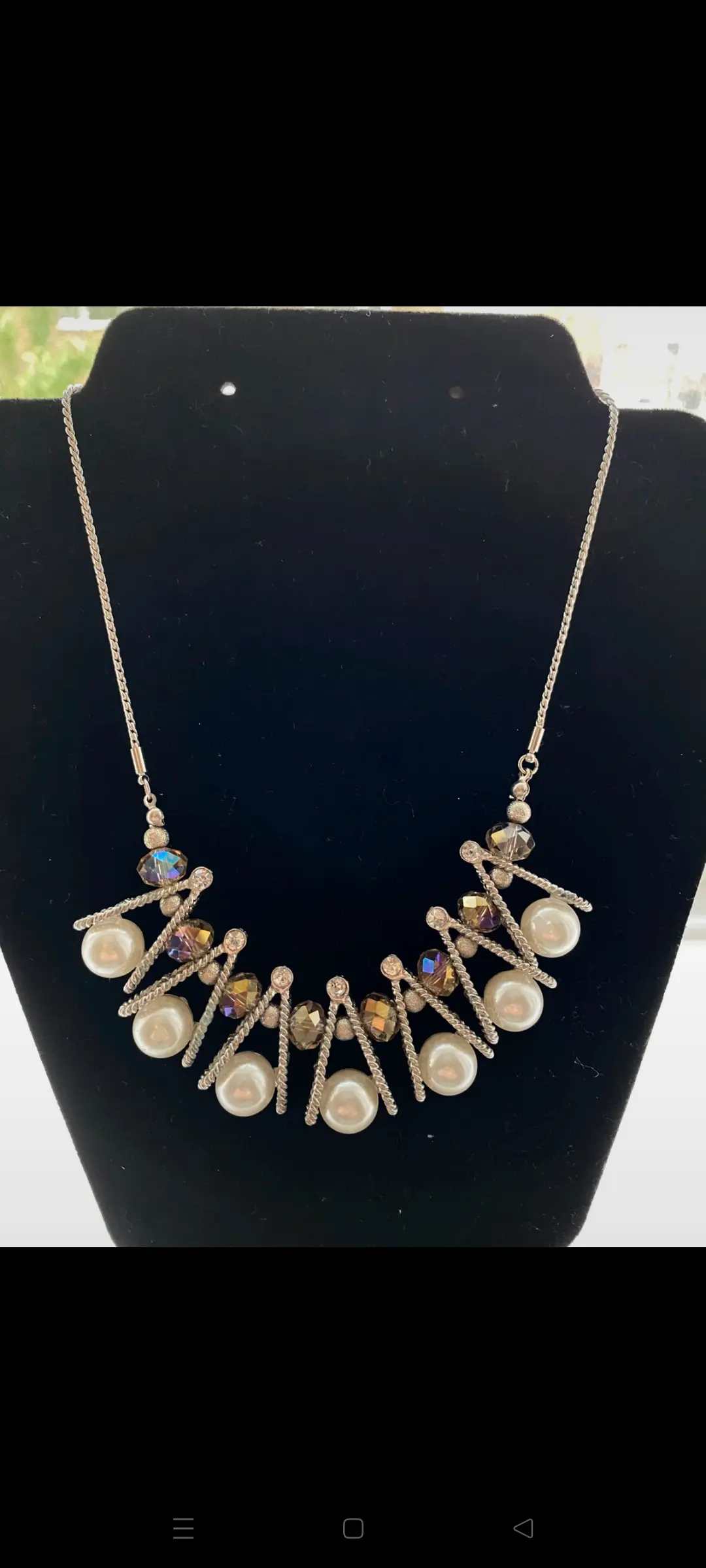 Statement Necklace Featuring faux pearl rhinestone and silver tone metal